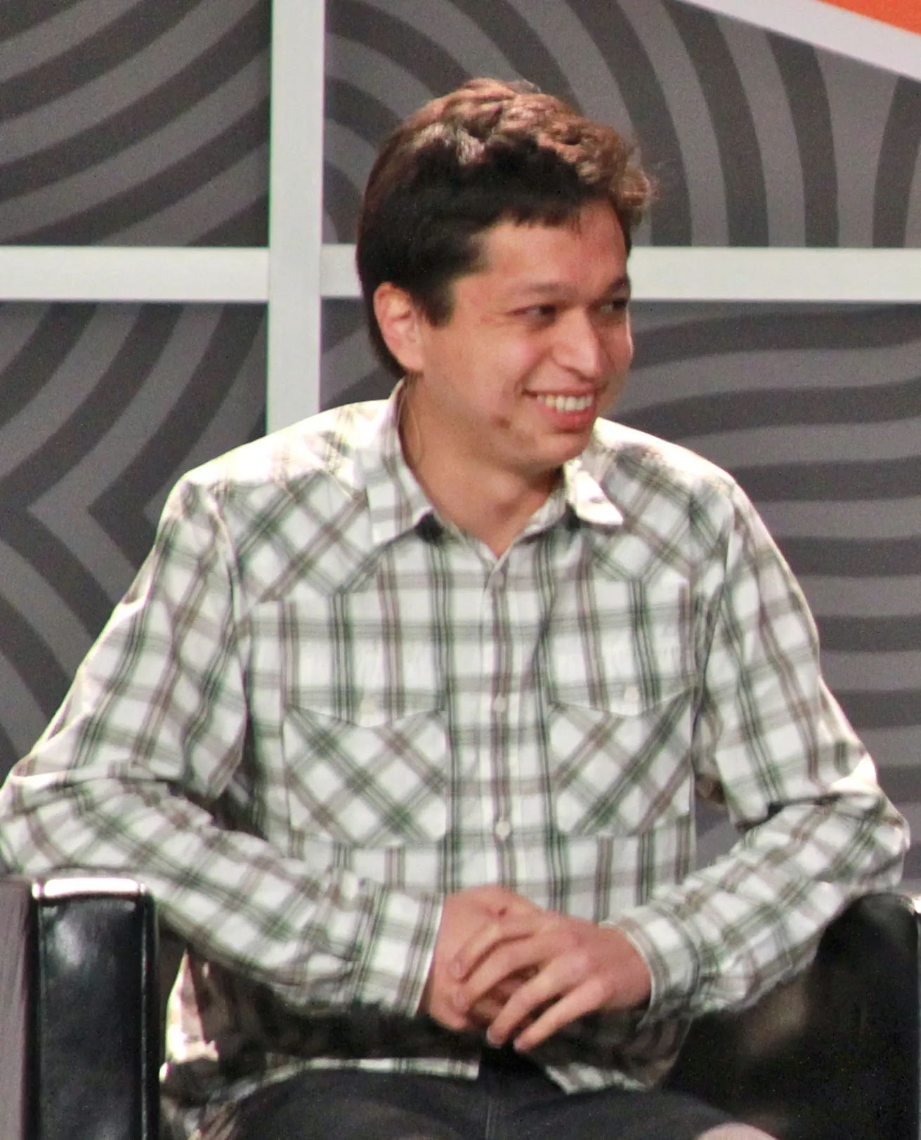 Seated portrait of Ben Silbermann mid-interview