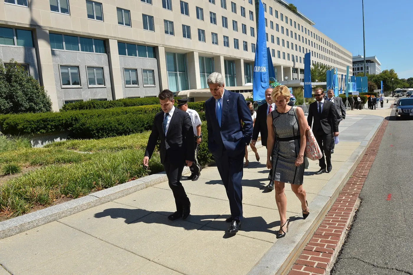 Chesky walking with John Kerry outside Our Ocean event
