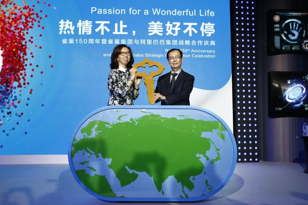 Daniel Zhang with Nestlé executive Wan Ling Martello at a corporate event (Flickr via Openverse, by-nc-nd 2.0, Nestlé)