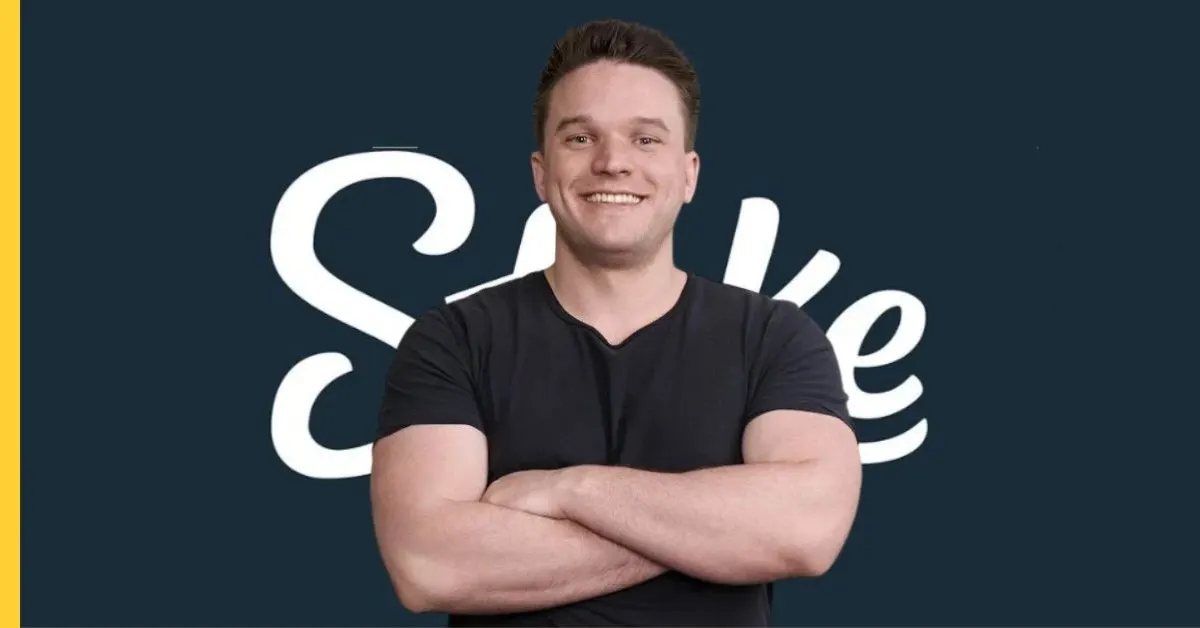 Craven in front of Stake wordmark on navy backdrop