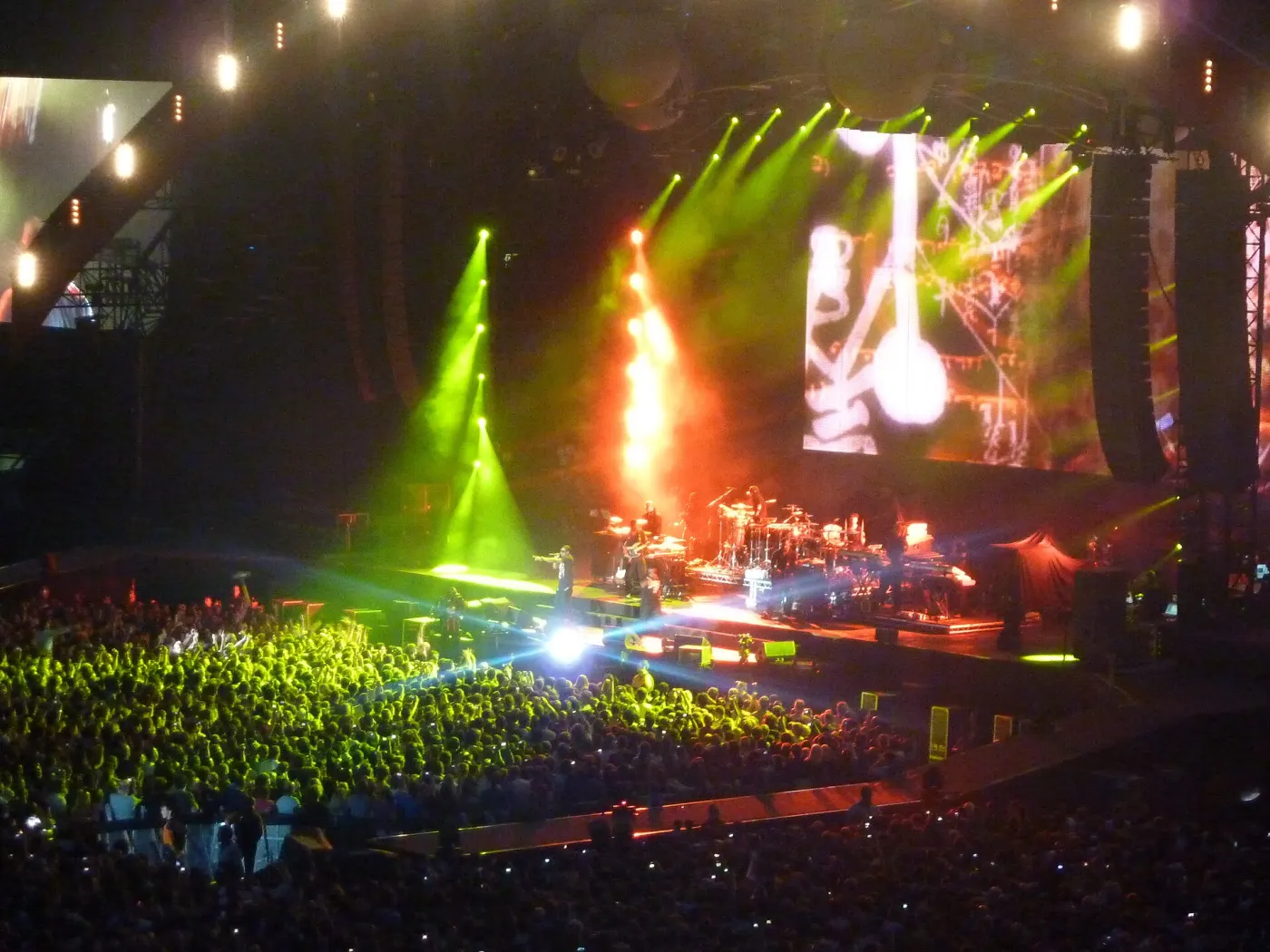 Wide stadium concert view with stage lights