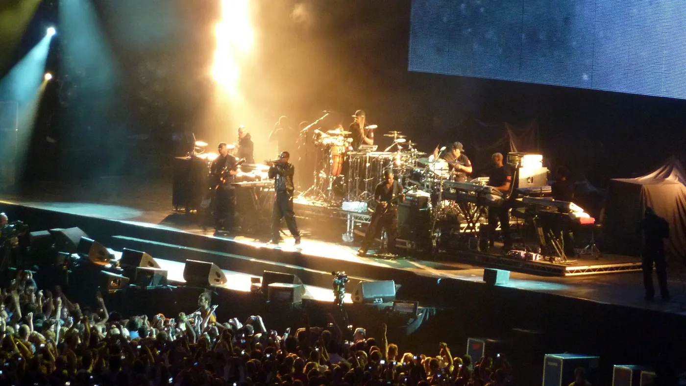 Stadium stage with band and big screens