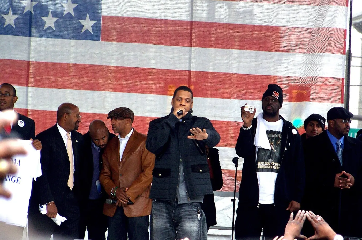 On a rally stage in front of an American flag