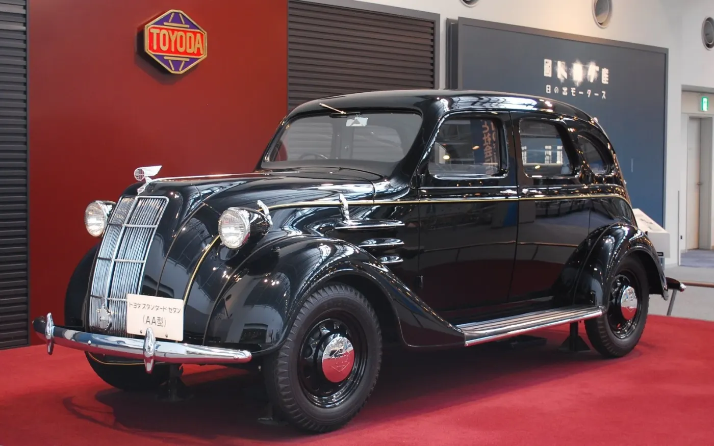 Black Model AA sedan on a red museum floor