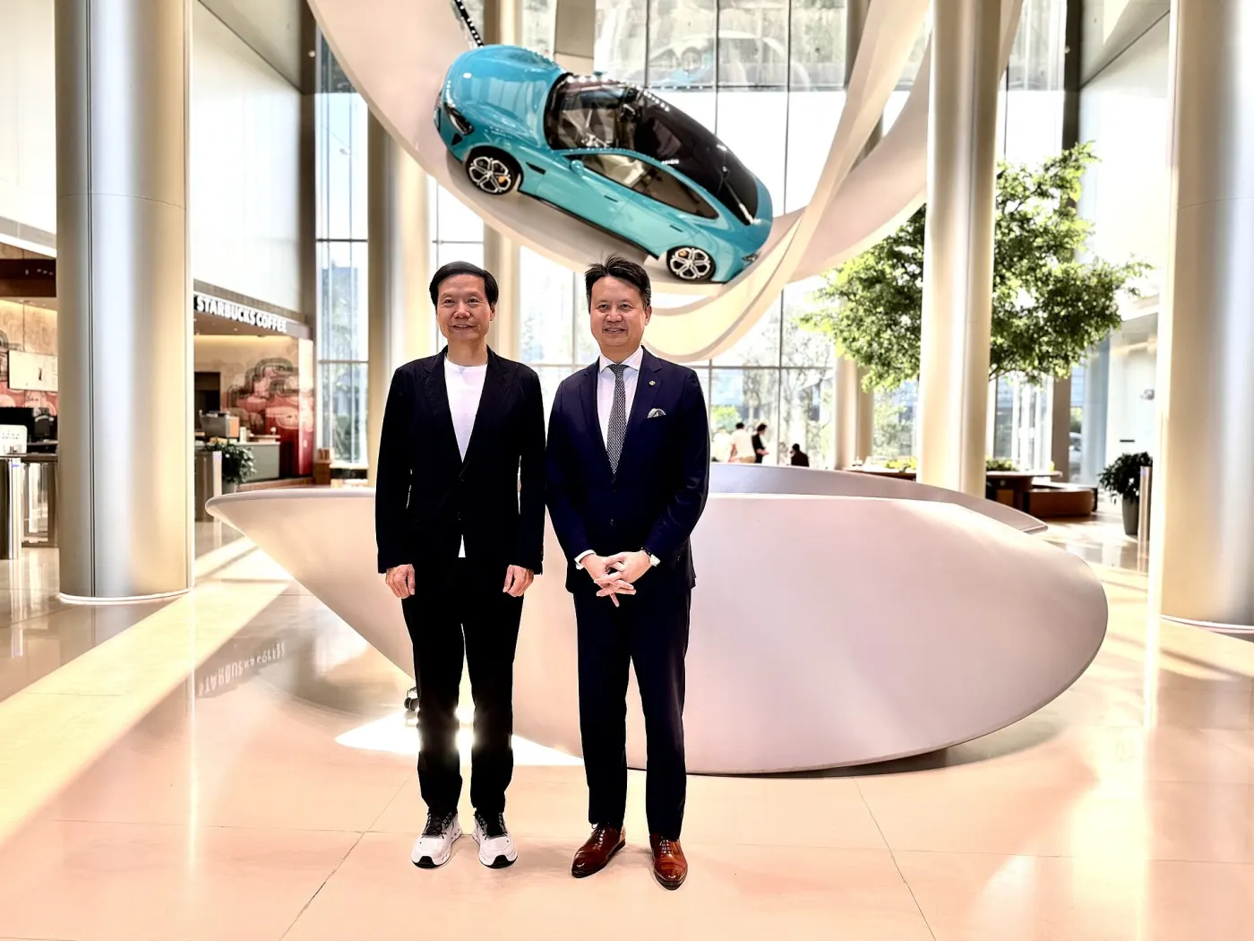 Visitors at Xiaomi's EV plant in Beijing (Wikimedia Commons, credit needed)