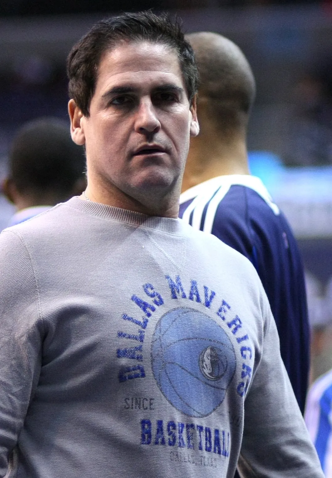 Mark Cuban in a gray Dallas Mavericks sweatshirt at courtside
