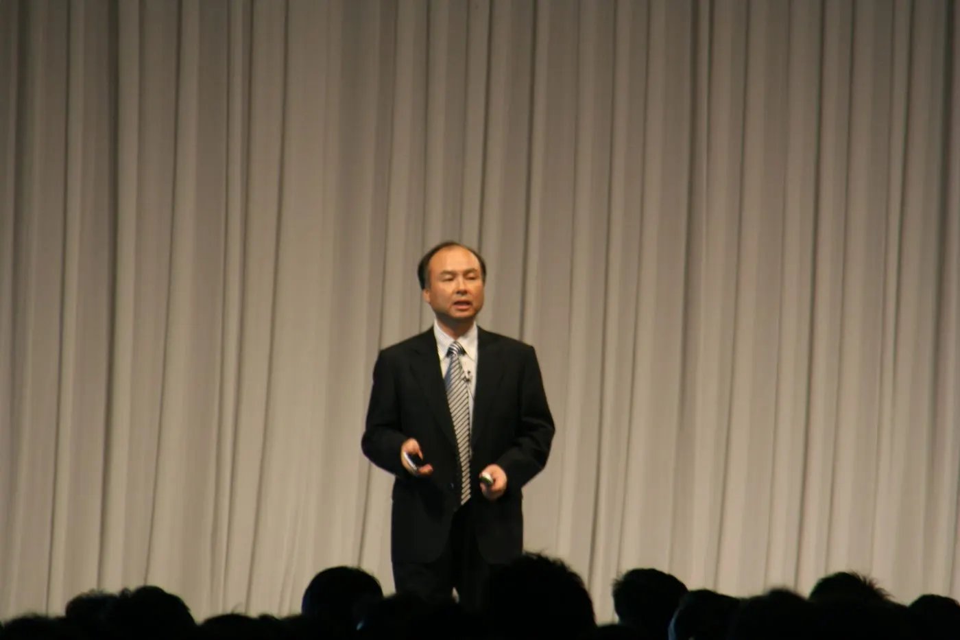 Masayoshi Son speaking on stage