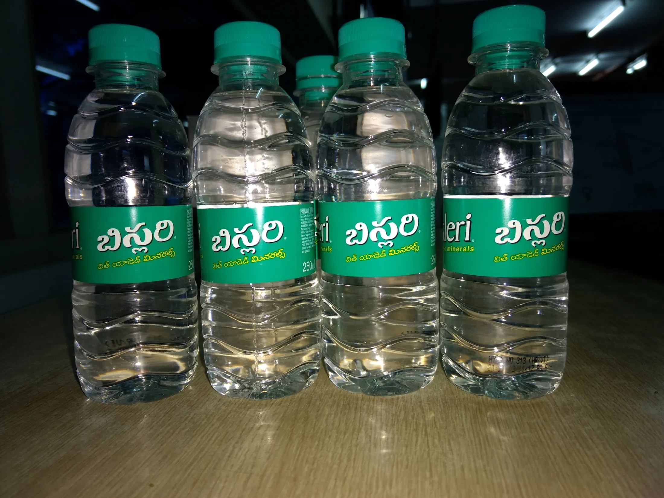 Bisleri bottles on a shelf (Wikimedia Commons, CC BY-SA 4.0)