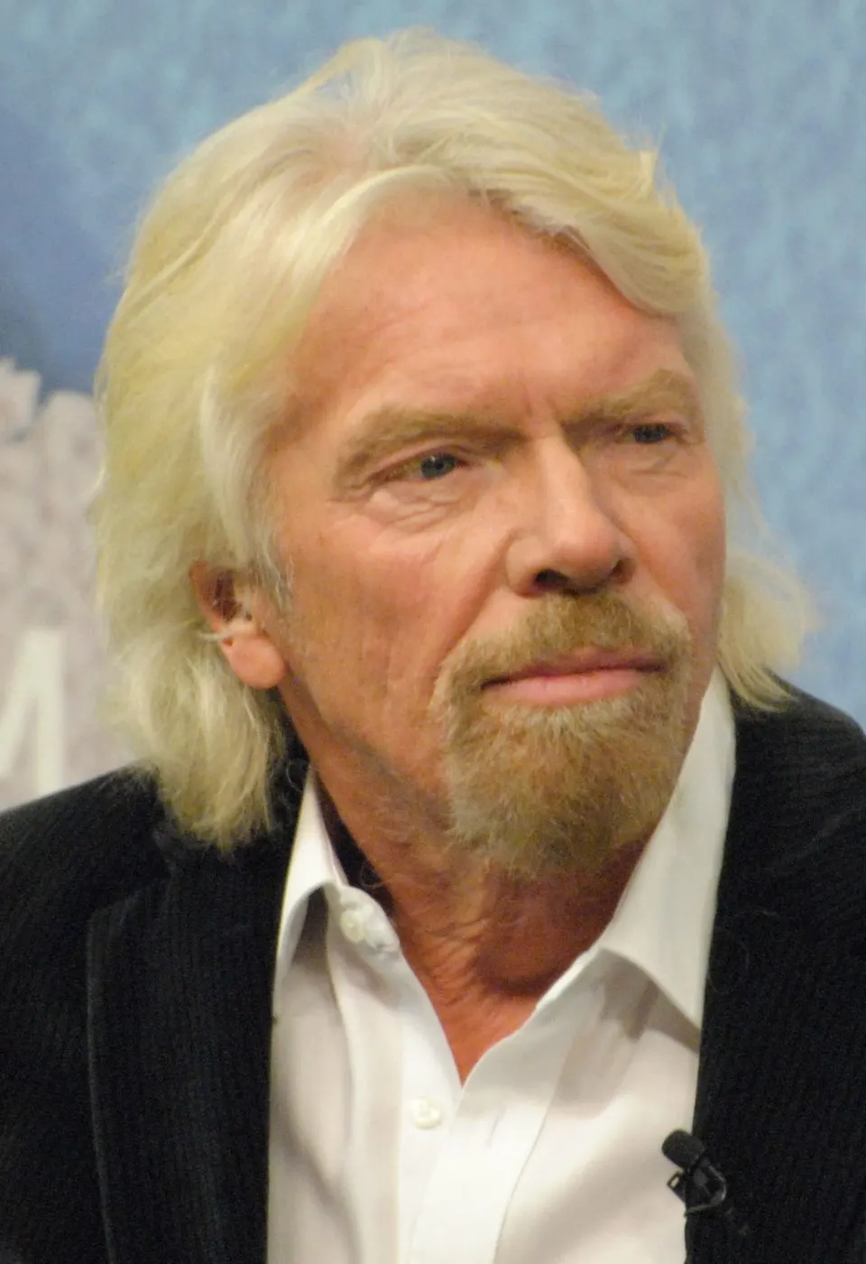 Close portrait of Richard Branson with lapel mic