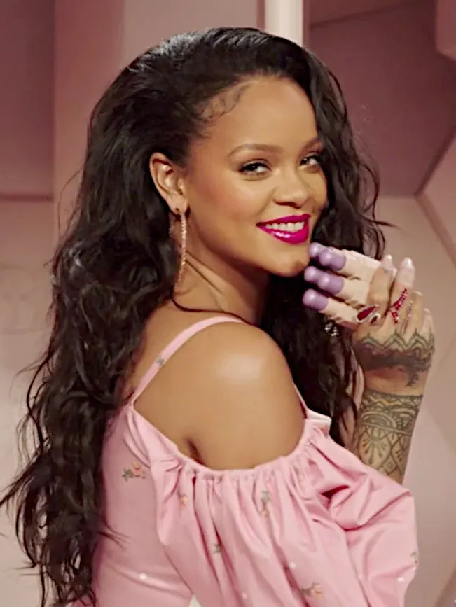 Pink off-shoulder top, long waves, laughing pose