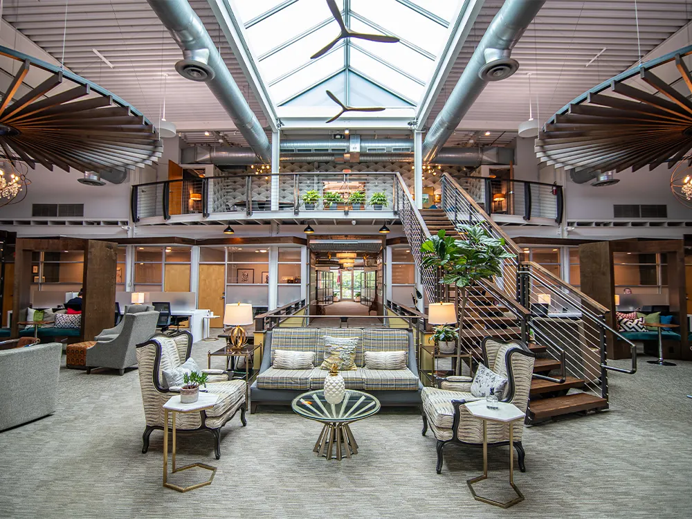 High-design coworking lounge with skylight and glass pods