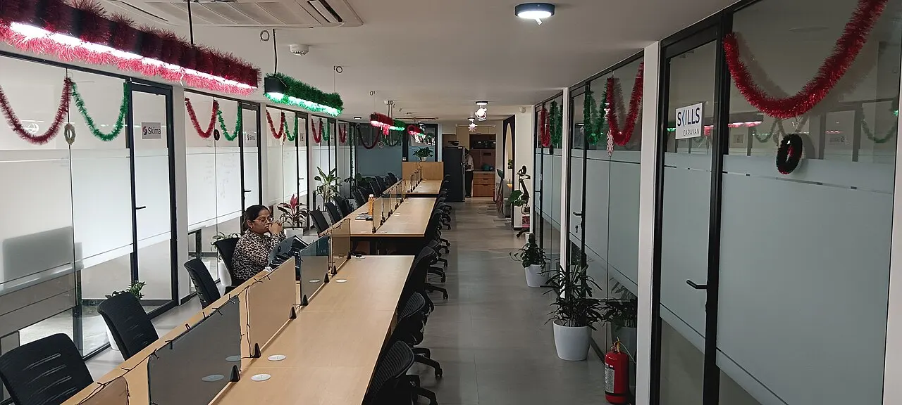 Coworking corridor with member offices and festive lights