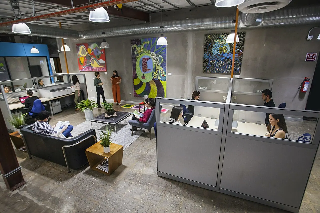 Industrial coworking lounge with art wall