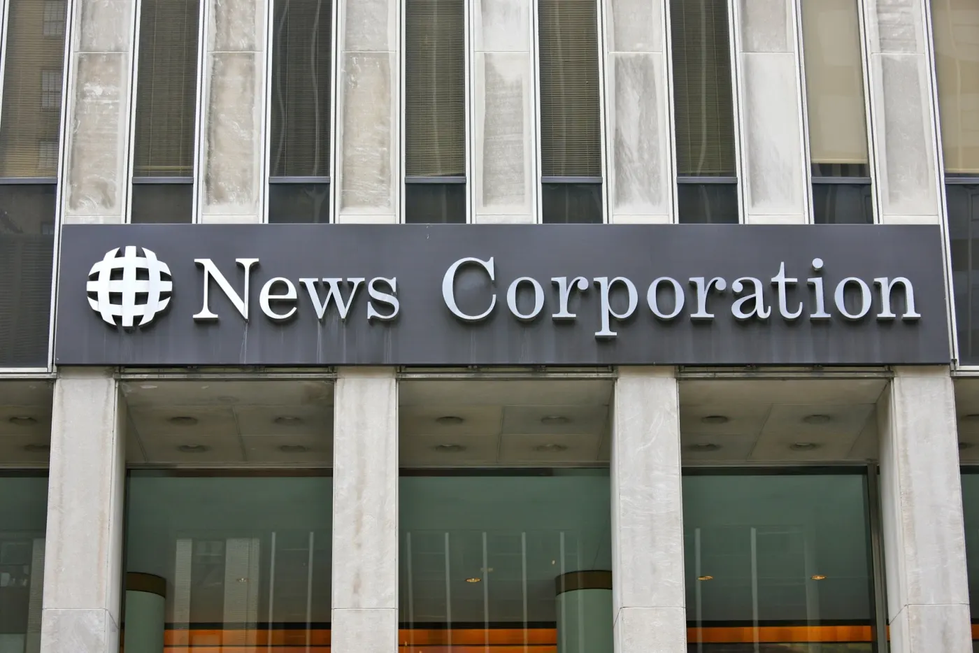 Close view of News Corporation lettering above glass doors