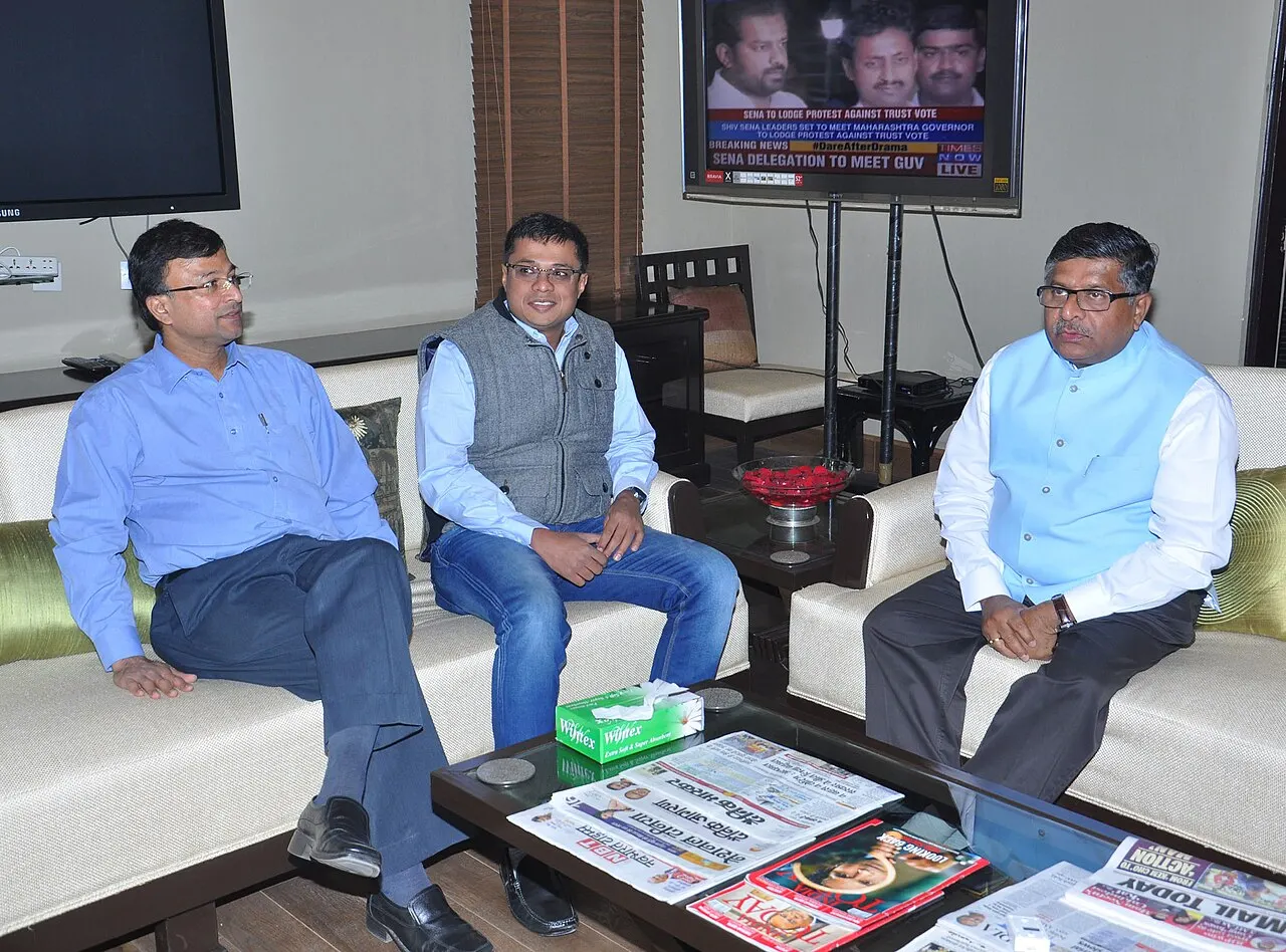 Sachin Bansal seated with then minister Ravi Shankar Prasad in a formal lounge