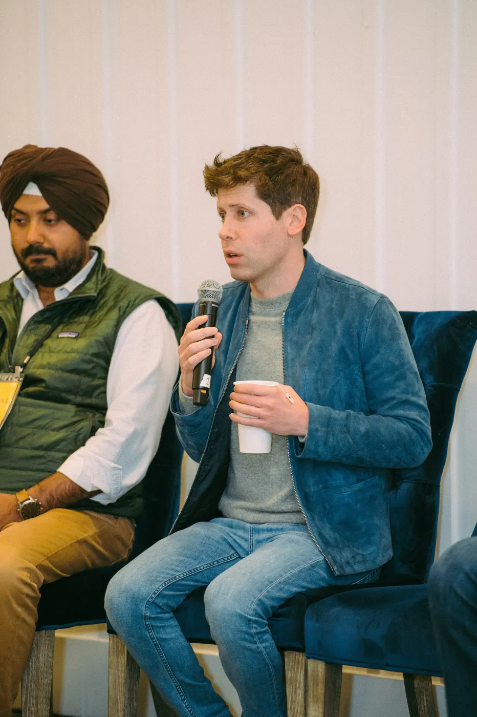 Sam Altman on panel with microphone