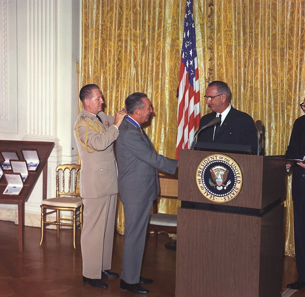 President Lyndon Johnson presents Walt the Presidential Medal of Freedom, White House, 1964