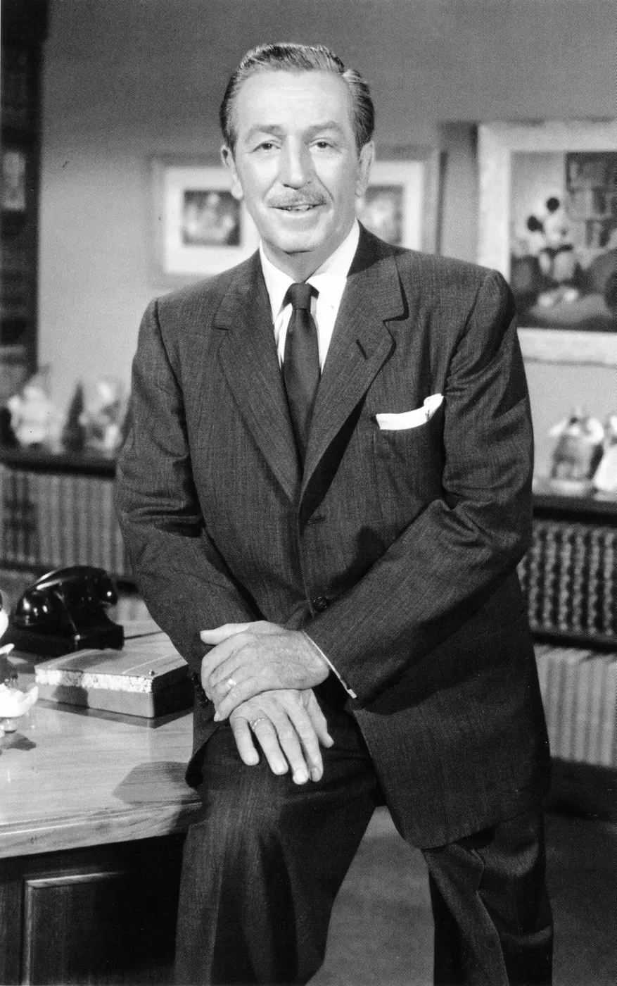 Smiling close portrait of Walt in suit and tie