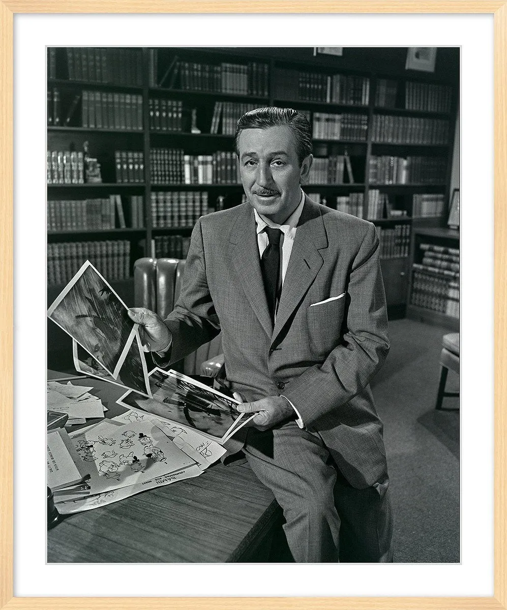 Walt seated in a library